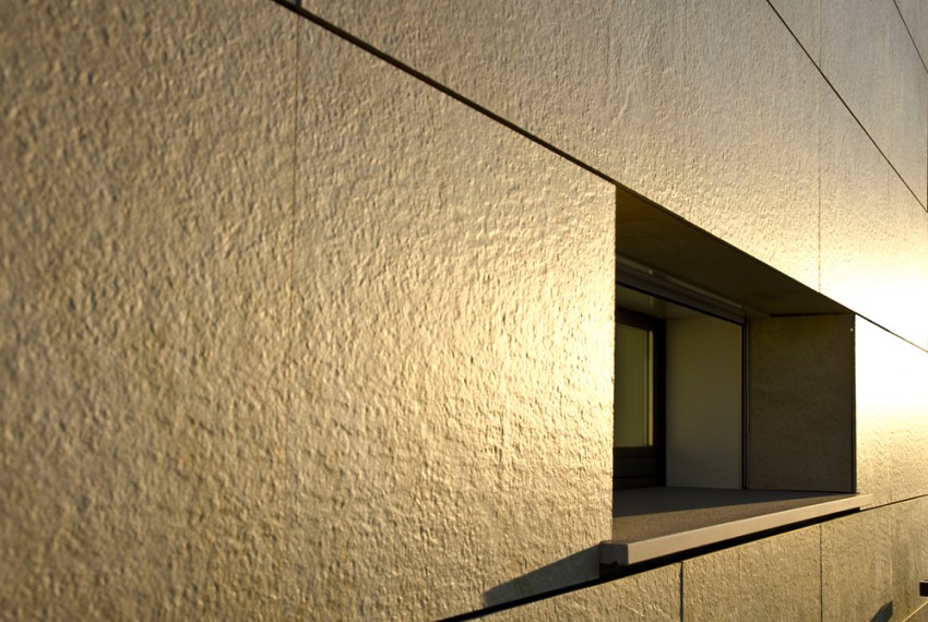 External view of a contemporary house with pool at dusk